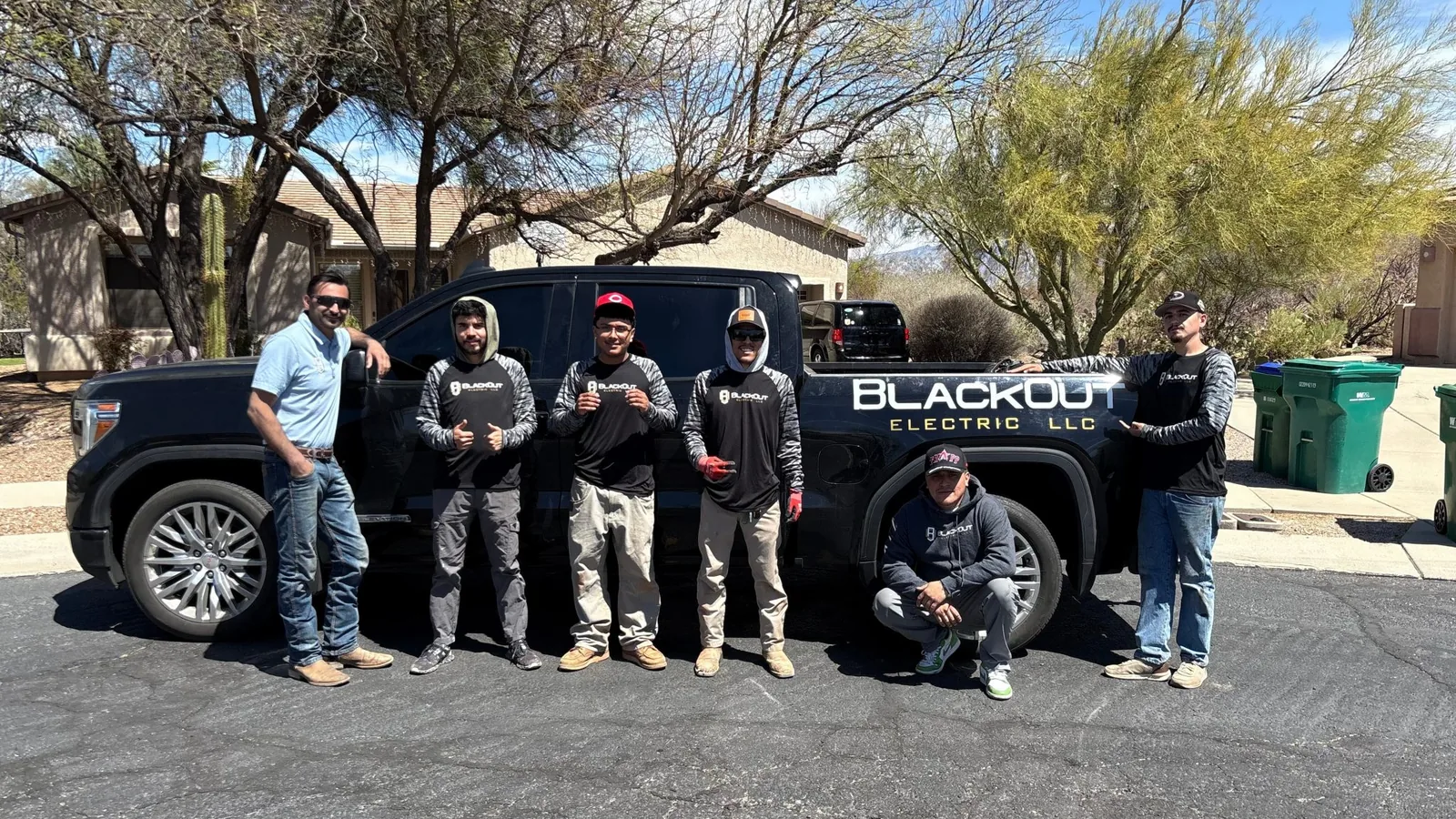 The Blackout Electric crew with a company truck on a job site in the Phoenix metro